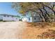 Expansive yard space featuring mature trees and a mix of gravel and grass at 3823 N 56Th St, Tampa, FL 33619