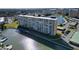 Stunning aerial view of waterfront apartment building with boat docks and scenic water views at 4725 Cove Cir # 601, St Petersburg, FL 33708