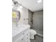 Bathroom with a white vanity and modern shower featuring gray tile at 4725 Cove Cir # 601, St Petersburg, FL 33708