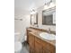 Bathroom with granite counters, double vanity, and custom lighting, featuring a pristine sink at 4725 Cove Cir # 601, St Petersburg, FL 33708