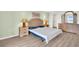 Bedroom featuring a large bed, natural lighting, and ample closet space at 4725 Cove Cir # 601, St Petersburg, FL 33708