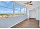 Sunroom with large windows and views of the city, perfect for relaxation and entertaining at 4725 Cove Cir # 601, St Petersburg, FL 33708