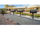 Outdoor grilling area with multiple built-in grills and a wooden deck area for grilling at 4725 Cove Cir # 601, St Petersburg, FL 33708