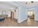 Open living room with wood look floors, light-filled space with seating, and views at 4725 Cove Cir # 601, St Petersburg, FL 33708