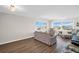 Cozy living room with comfortable seating and scenic views from bright windows at 4725 Cove Cir # 601, St Petersburg, FL 33708