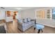 Comfortable living room features hardwood floors and a glimpse into the adjacent kitchen at 4725 Cove Cir # 601, St Petersburg, FL 33708