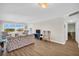 Spacious living room with modern furnishings, hardwood floors, and an ocean view at 4725 Cove Cir # 601, St Petersburg, FL 33708