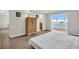 Bedroom featuring a spacious layout, neutral tones, and access to an outdoor balcony with water views at 4725 Cove Cir # 601, St Petersburg, FL 33708