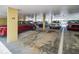 Covered parking garage with assigned parking spaces and multiple parked vehicles at 4725 Cove Cir # 601, St Petersburg, FL 33708