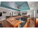 Living room bar area with bar seating, a wooden bar, and a television at 4997 W Breeze Cir, Palm Harbor, FL 34683