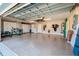 Spacious garage with storage cabinets and epoxy flooring at 4997 W Breeze Cir, Palm Harbor, FL 34683