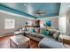 Living room with comfortable seating, modern decor, and hardwood floors at 4997 W Breeze Cir, Palm Harbor, FL 34683