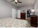 Bedroom featuring a closet and dresser, with hardwood floors and natural light at 4997 W Breeze Cir, Palm Harbor, FL 34683