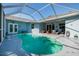 Enclosed pool with outdoor seating at 4997 W Breeze Cir, Palm Harbor, FL 34683