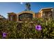 Community sign with purple flowers in foreground at 4997 W Breeze Cir, Palm Harbor, FL 34683