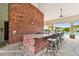 Community outdoor bar area with barstools and view of the community pool at 5276 6Th N Way, St Petersburg, FL 33703