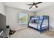 Bright bedroom with a bunk bed and a large window allowing natural light at 5276 6Th N Way, St Petersburg, FL 33703