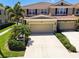 Beautiful two-story townhome with a tile roof, well-maintained landscaping, and a two-car garage at 5276 6Th N Way, St Petersburg, FL 33703