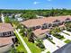 Exterior shot of townhomes with beautiful lawns and landscaping plus driveways and garages at 5276 6Th N Way, St Petersburg, FL 33703