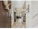 Inviting foyer showcasing an open floor plan, tile flooring, and a glimpse of the living spaces at 5276 6Th N Way, St Petersburg, FL 33703