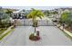 Aerial view of the community's gated entrance with a palm tree in the center at 5276 6Th N Way, St Petersburg, FL 33703