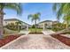 Lounge area with hammocks between tropical trees and lush landscaping at 5276 6Th N Way, St Petersburg, FL 33703