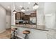 Stylish kitchen with a breakfast bar, stainless steel appliances, granite counters, and pendant lights at 5276 6Th N Way, St Petersburg, FL 33703