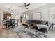 Open-concept living room featuring sleek tile flooring, modern furnishings, and an abundance of natural light at 5276 6Th N Way, St Petersburg, FL 33703