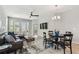 Spacious living room features a ceiling fan, plenty of windows, and a comfortable seating area at 5276 6Th N Way, St Petersburg, FL 33703