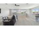 Spacious living room with plush carpeting, natural light from the large windows, and a cozy seating area at 5276 6Th N Way, St Petersburg, FL 33703