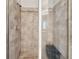 Elegant walk-in shower featuring neutral toned tiling and a built-in bench at 5276 6Th N Way, St Petersburg, FL 33703