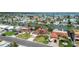 Aerial view of waterfront home with lush yard, private dock, and convenient street access at 543 Crystal Dr, Madeira Beach, FL 33708