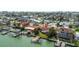 Waterfront home featuring private dock, lush landscaping, and serene water views at 543 Crystal Dr, Madeira Beach, FL 33708