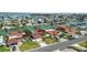Aerial shot of waterfront home with tile roof, well-manicured yard, and canal access at 543 Crystal Dr, Madeira Beach, FL 33708