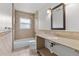 Neutral bathroom with tiled shower-tub combo and single sink vanity at 543 Crystal Dr, Madeira Beach, FL 33708
