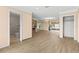 A view of the open-concept living area with a full bathroom, new flooring, and an outdoor view at 543 Crystal Dr, Madeira Beach, FL 33708