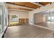 Open-concept living area featuring wood paneled ceilings, waterfront views, and neutral walls at 543 Crystal Dr, Madeira Beach, FL 33708