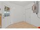 Clean utility room with white walls, tile floors, and an electrical panel at 543 Crystal Dr, Madeira Beach, FL 33708