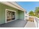 A green deck overlooking the backyard with plenty of space to relax and entertain at 581 Oceanview Ave, Palm Harbor, FL 34683
