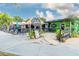 Cooldside Gelato Bar featuring outdoor seating, landscaping, and a vibrant atmosphere at 581 Oceanview Ave, Palm Harbor, FL 34683