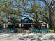 Ozona Brewing Company with outdoor seating, lush landscaping, and a shaded patio at 581 Oceanview Ave, Palm Harbor, FL 34683