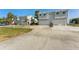 Exterior view of two story townhouse with garage and driveway at 581 Oceanview Ave, Palm Harbor, FL 34683
