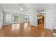 Bright and airy living room with vaulted ceilings and a sliding glass door leading to a deck at 581 Oceanview Ave, Palm Harbor, FL 34683