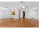 Spacious living area with laminate floors, ceiling fan and staircase at 581 Oceanview Ave, Palm Harbor, FL 34683