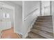 Carpeted staircase leading to the second floor with a hallway to other rooms at 581 Oceanview Ave, Palm Harbor, FL 34683