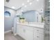 Bathroom featuring a large mirror, vanity, and beach themed decorations at 5816 Dory Way, Tampa, FL 33615