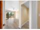 Bright bedroom with wood look tile flooring, sliding glass doors to the deck and a closet at 5816 Dory Way, Tampa, FL 33615
