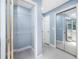 Closet and hallway with mirrored closet doors, blue walls, and tile flooring at 5816 Dory Way, Tampa, FL 33615