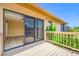 This property features a wooden deck right off of the Primary bedroom with waterfront views at 5816 Dory Way, Tampa, FL 33615