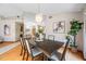 Dining room featuring a large table with seating for six and modern chandelier at 5816 Dory Way, Tampa, FL 33615